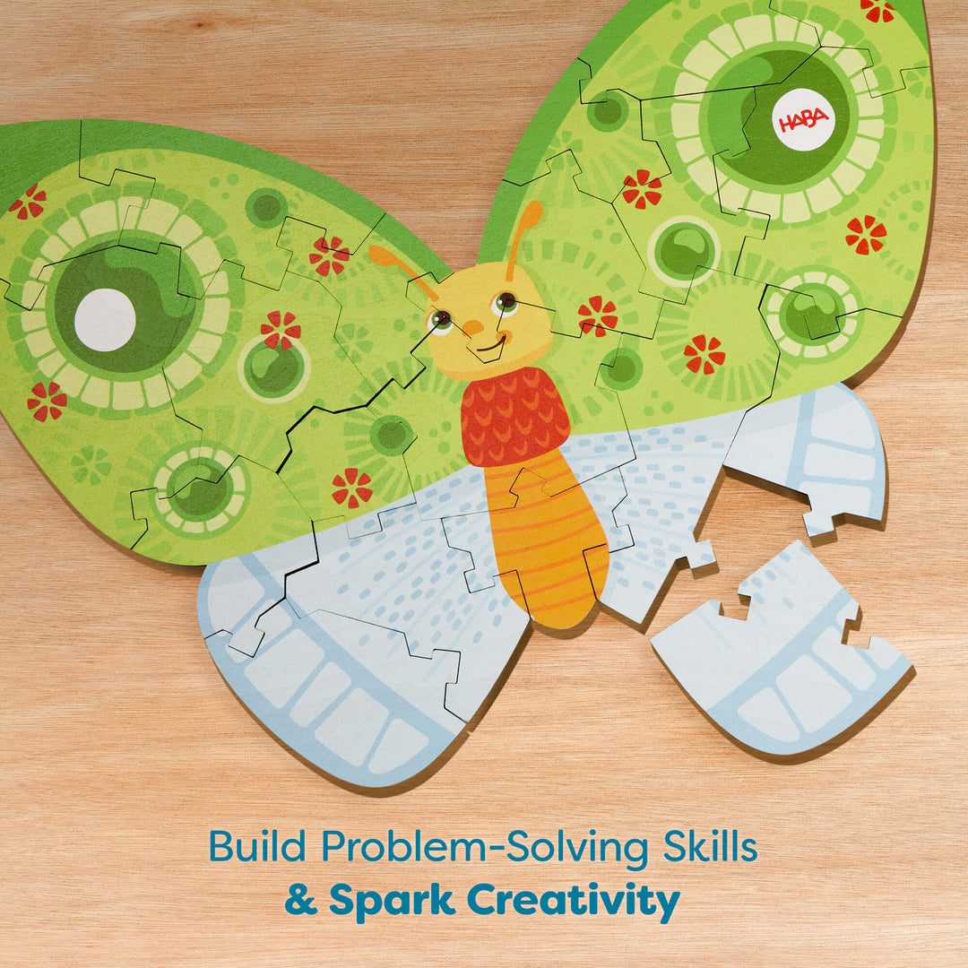 A butterfly-shaped puzzle on a wooden surface with colorful wings and text below reading "Build Problem-Solving Skills & Spark Creativity"