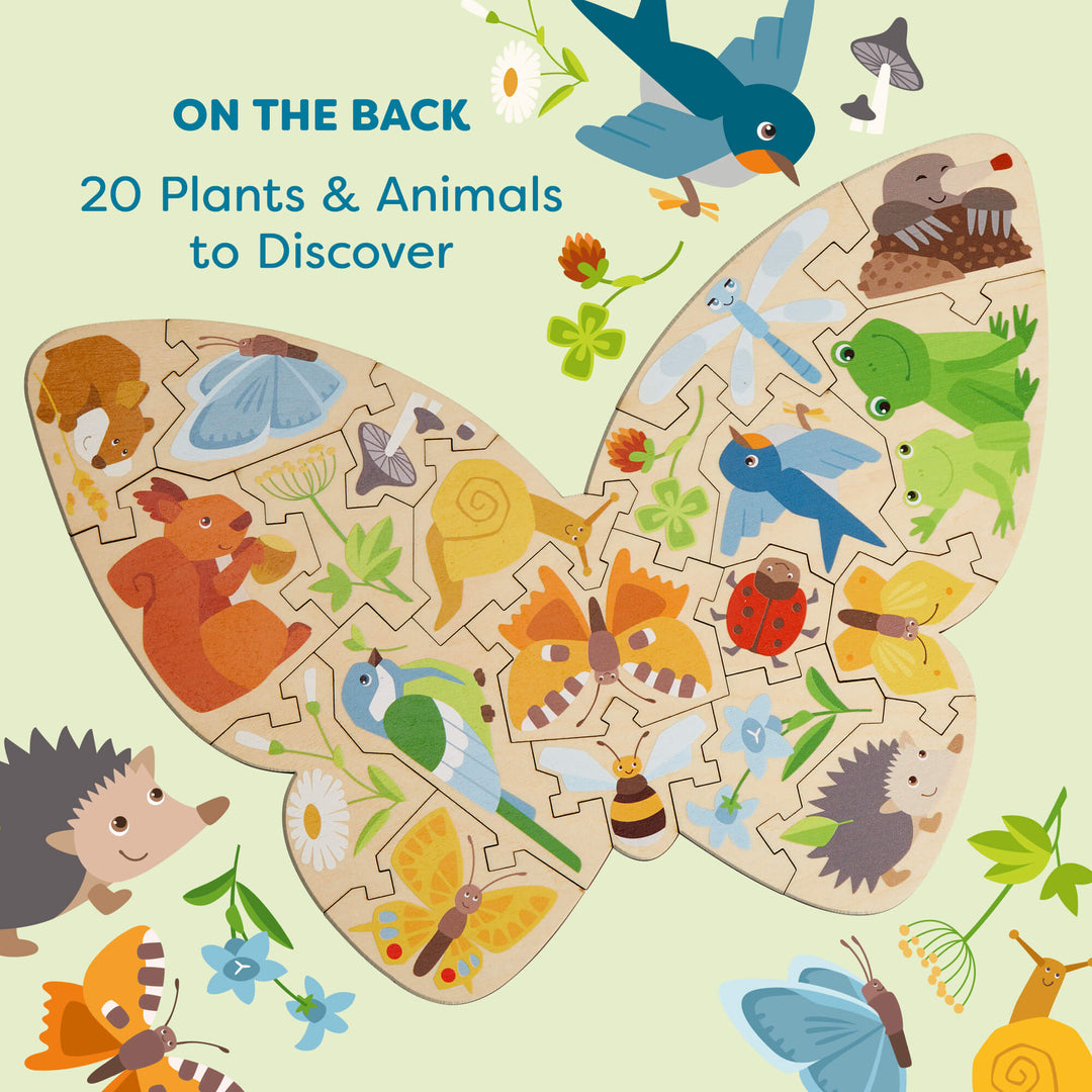 A colorful butterfly-shaped puzzle featuring animals and plants against a light green background. Text reads "ON THE BACK 20 Plants & Animals to Discover"