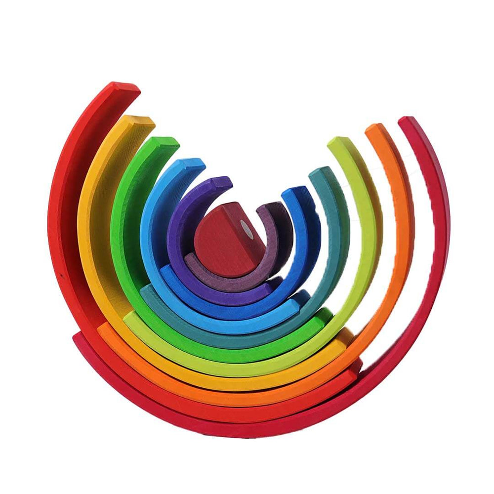 Set of rainbow-colored wooden rings stacked in a circular pattern on a white background.