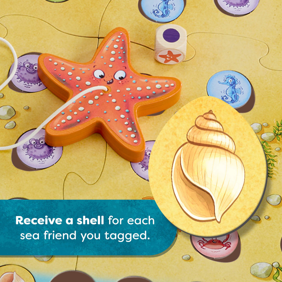 Board game piece with a starfish and shell on a sandy background. Receive a shell for each sea friend you tagged.