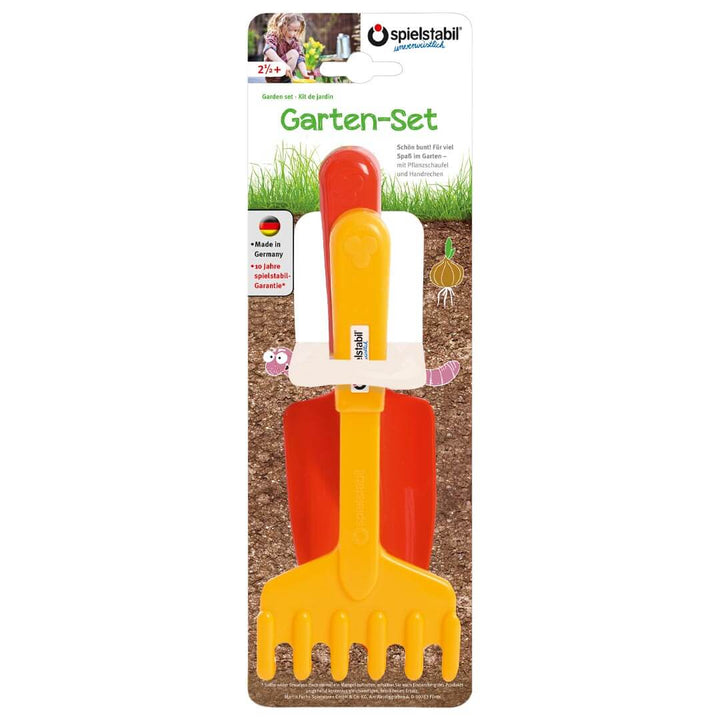 Spielstabil 2 Piece Garden Set with yellow hand rake and red spade in packaging