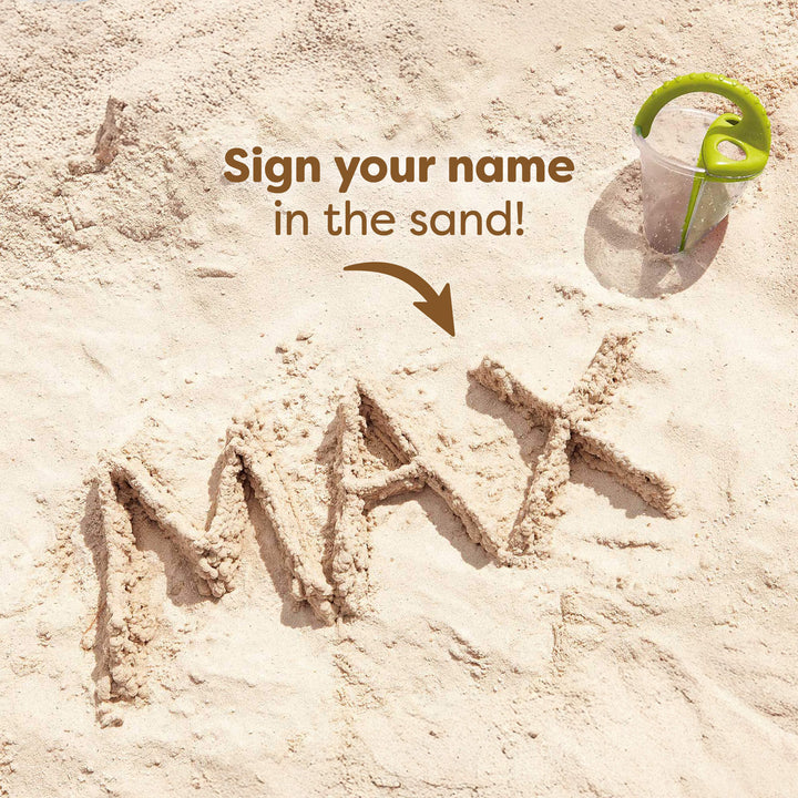 The word "MAX" written with sand on the beach. Text reads "Sign your name in the sand!"