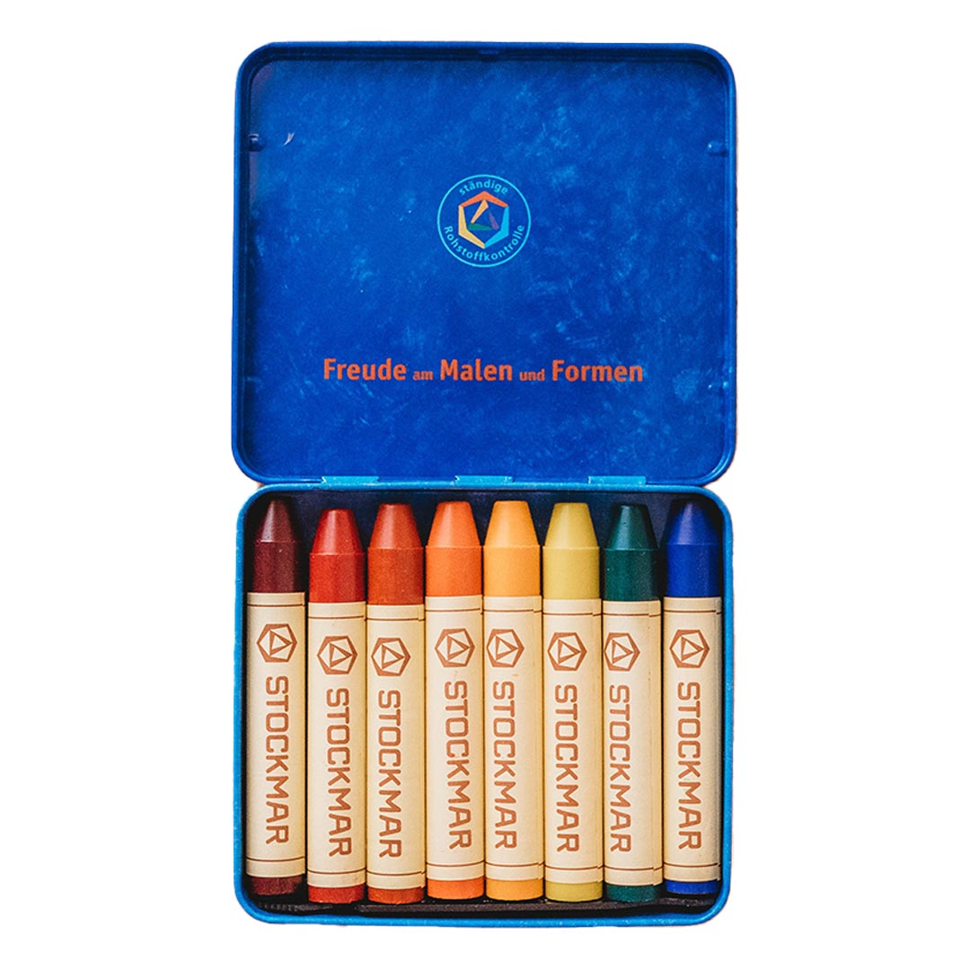 Set of Stockmar crayons in a blue tin with visible branding.