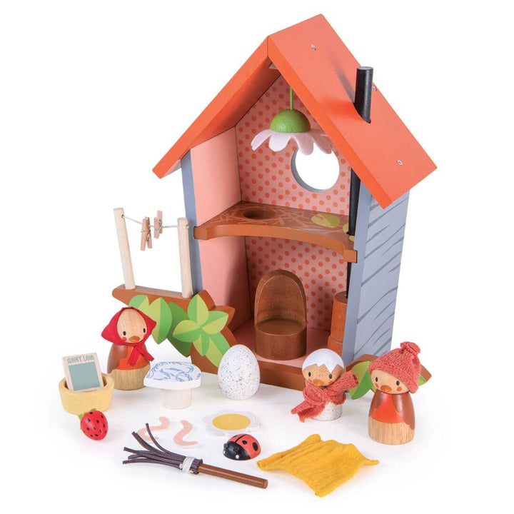 Tender Leaf Toys birdhouse playset with a small house, dolls, and accessories on a white background.