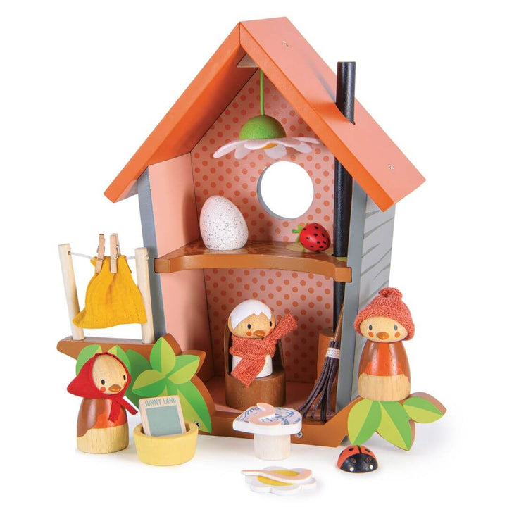 Wooden toy birdhouse dollhouse from Tender Leaf Toys with characters and accessories on a white background
