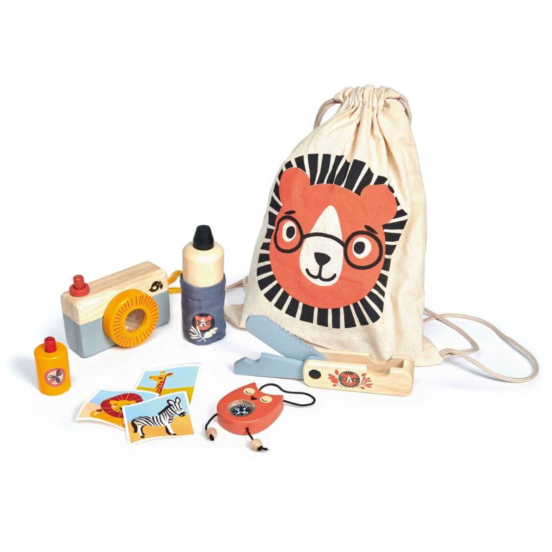 Tender Leaf Toys outdoor explorer set including a camera, bottle, and jump rope with a drawstring bag featuring a lion face on a white background.