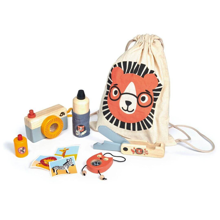 Tender Leaf Toys outdoor explorer set including a camera, bottle, and jump rope with a drawstring bag featuring a lion face on a white background.