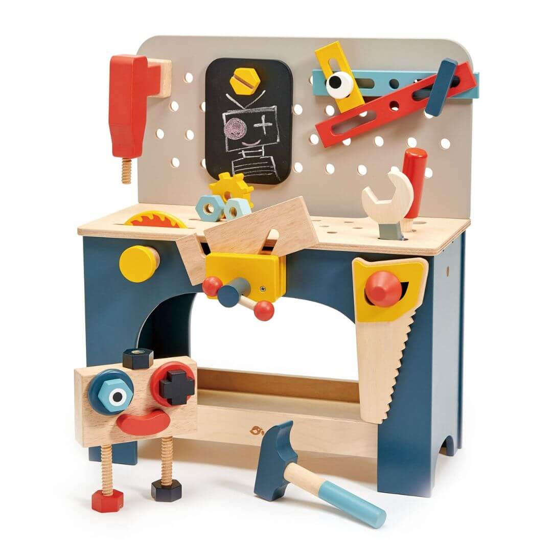 Children's wooden toy workbench with various tools and a chalkboard on a white background. Tender Leaf Toys