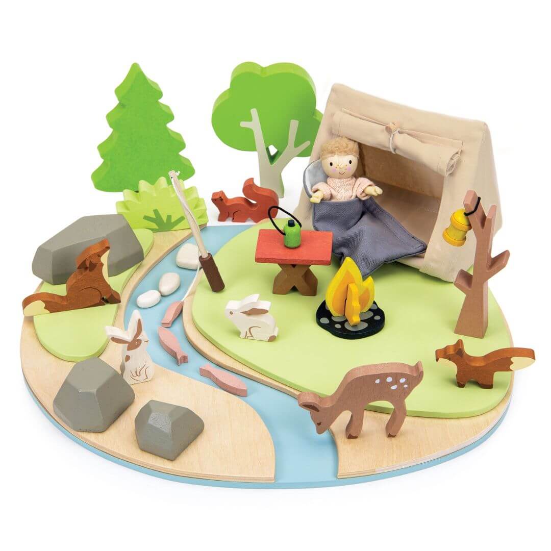 Wooden playset with a child in a tent, animals, and nature elements on a white background. Tender Leaf Toys