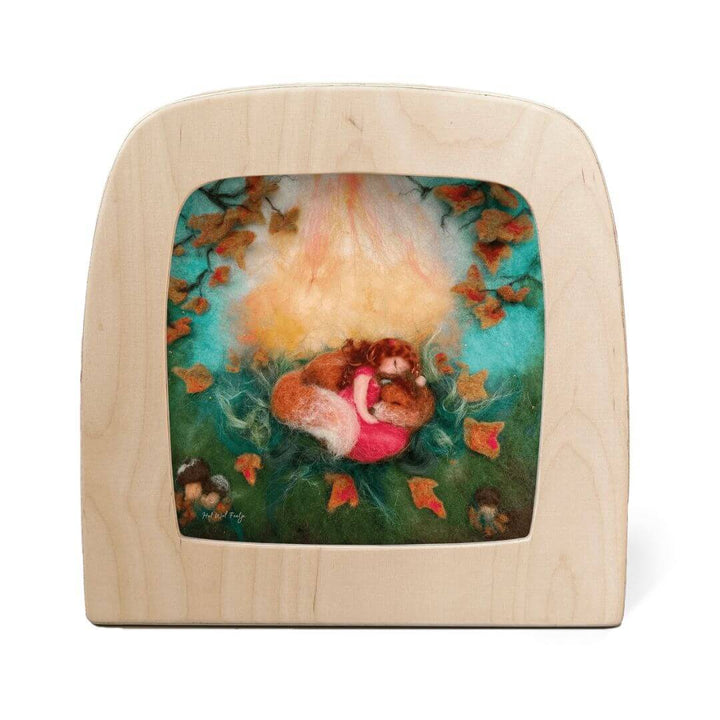 Toverlux Transparency: Autumn Snooze by Het Wol Feetje. This
illustrated transparency shows a cozy squirrel curled up in fallen leaves under a glowing canopy of autumn light, surrounded by warm fall colors.