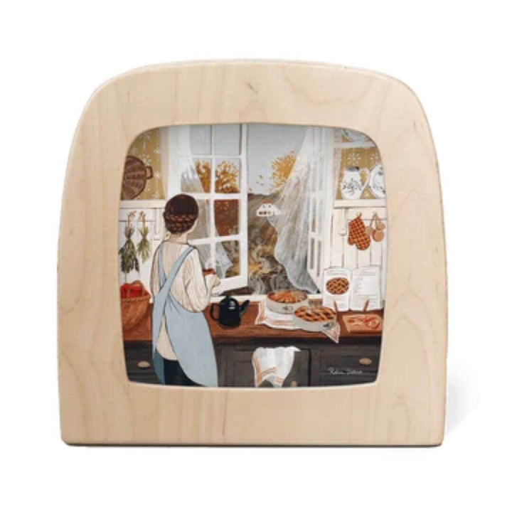 In “Apple Season,” Robin Pieterse captures the cozy comforts of home-warm light, the scent of baking, and autumn just beyond the window. A Toverlux Transparency that glows with everyday magic for Bella Luna Toys.