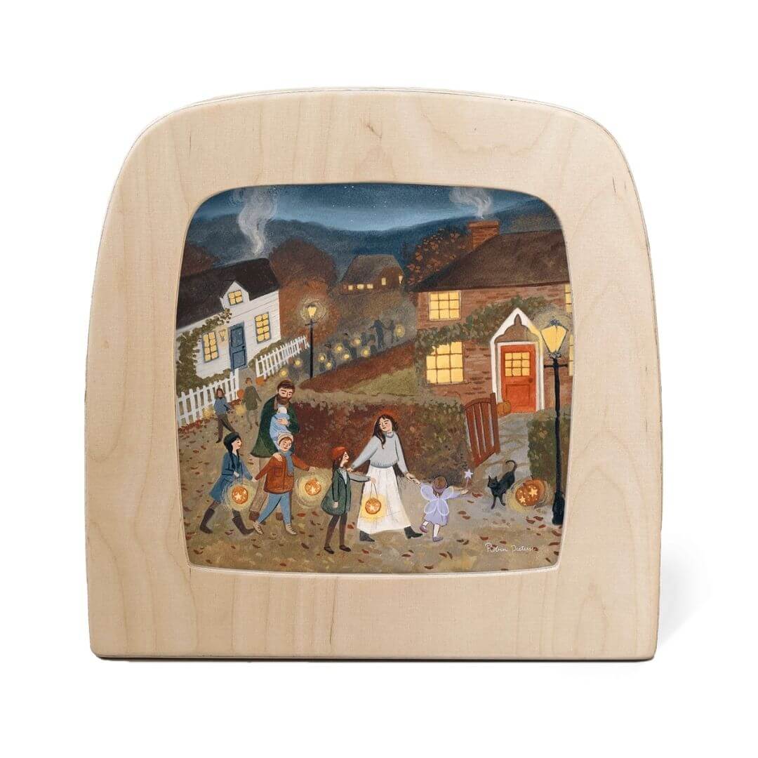 “Stars Below” by Robin Pieterse celebrates the magic of autumn evenings. Families carrying lanterns through a village glow softly when lit in the Toverlux Lamp - perfect for honoring Waldorf-inspired festivals of light fro Bella Luna Toys.