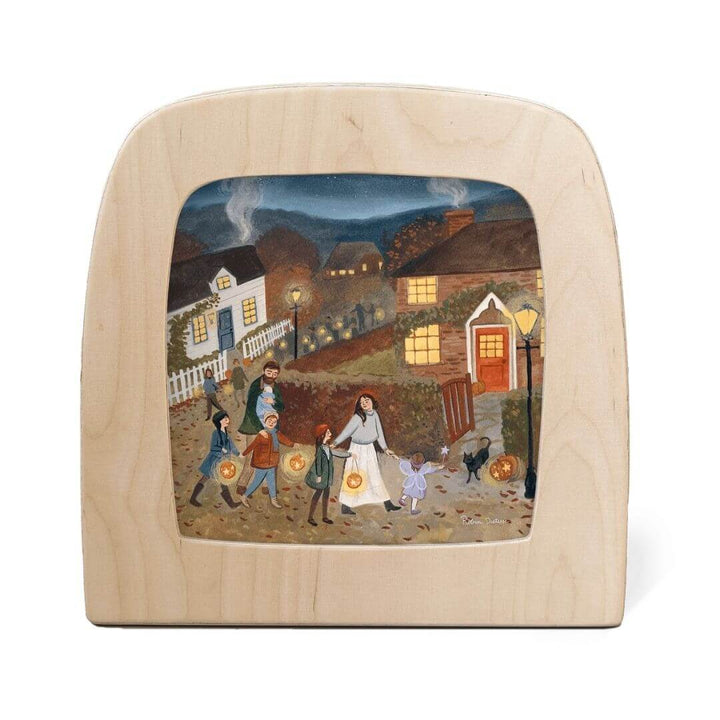 “Stars Below” by Robin Pieterse celebrates the magic of autumn evenings. Families carrying lanterns through a village glow softly when lit in the Toverlux Lamp - perfect for honoring Waldorf-inspired festivals of light fro Bella Luna Toys.