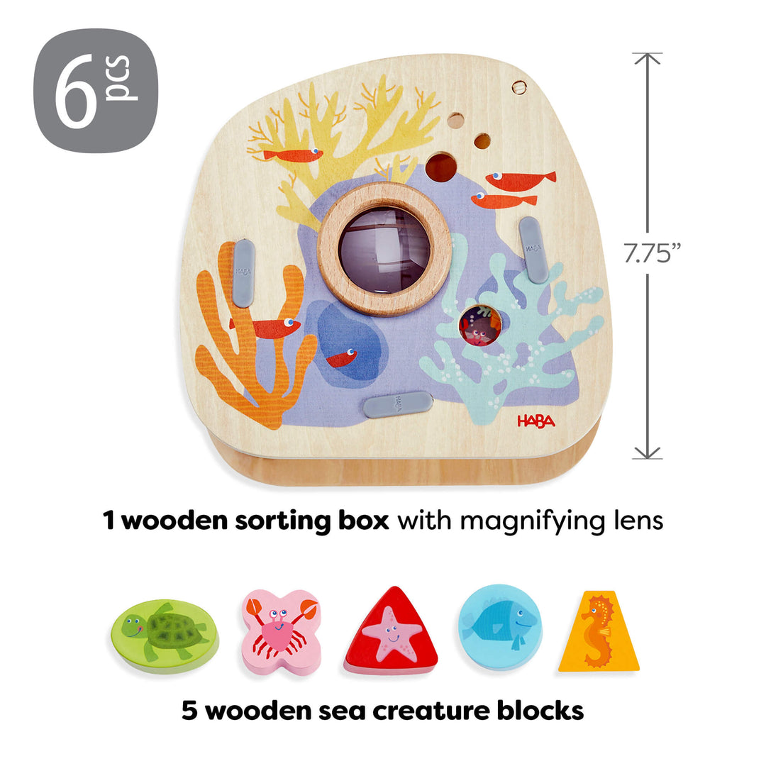 Underwater World Wooden Shape Sorter has 6 pieces including 1 wooden sorting box with magnifying lens and 5 wooden sea creature blocks