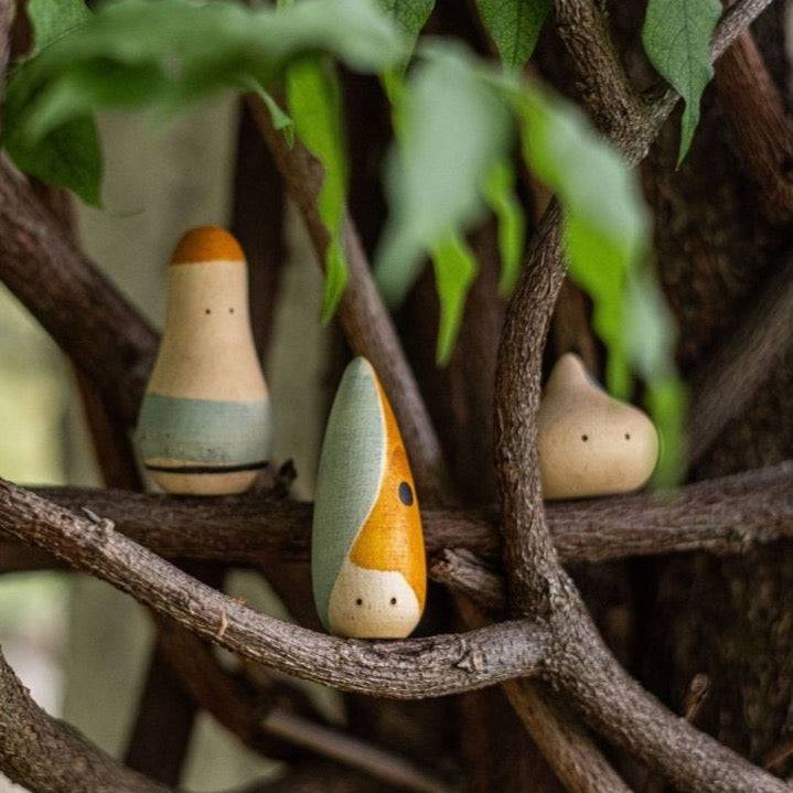 3 Hooray! Wooden Humanoid Figures sitting on tree branches