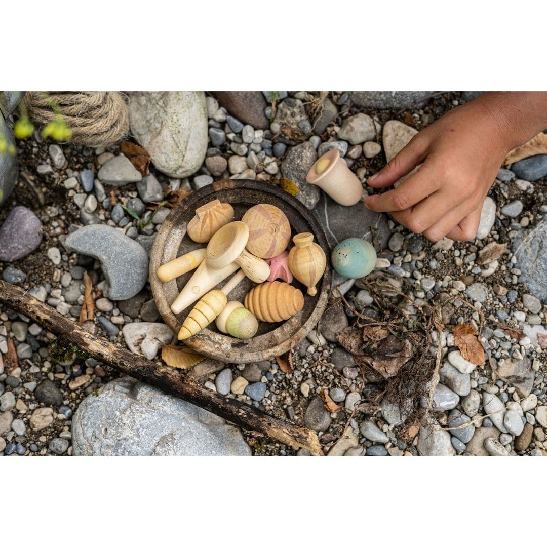 Child playing outside with Grapat Wonders Plant-Inspired Play Pieces- Bella Luna Toys