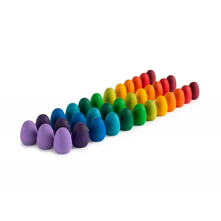 Grapat Mandala Wooden Rainbow Eggs neatly lined up by color