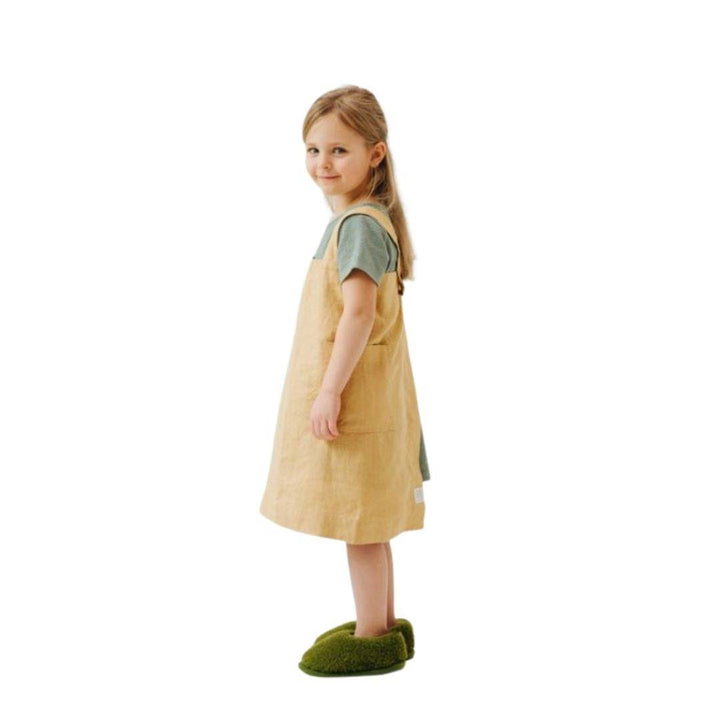 Child wearing Honey Apron - side view