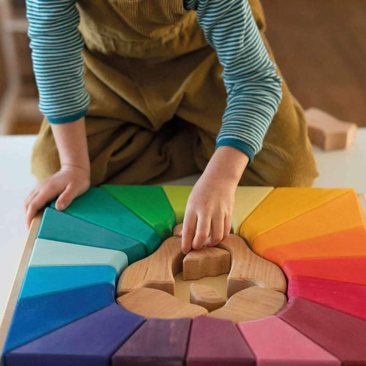 Boy Putting Together Grimm's Wooden Lion Puzzle - Building Set