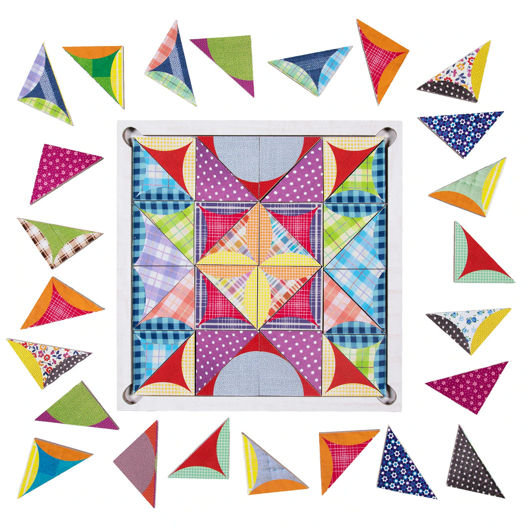 Image shows various patterns and colors of triangular pieces, some of which make up a design that looks like a quilt