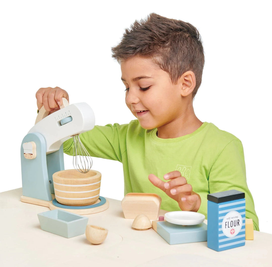 https://www.bellalunatoys.com/cdn/shop/products/childhappilyplayingwithbakingset.webp?v=1679003723&width=1080