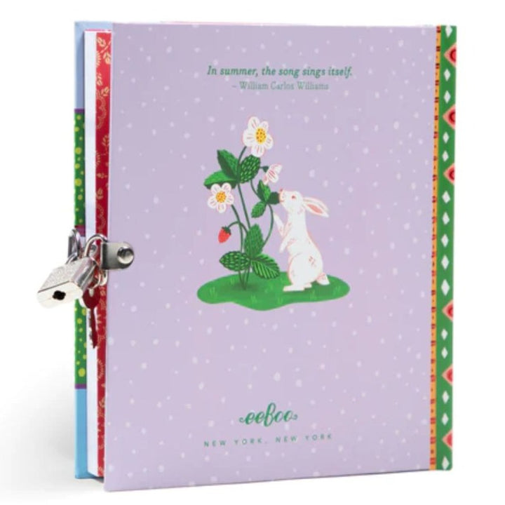 eeBoo- Back of strawberry journal. On the back is a drawing of a white rabbit smelling the flowers of a strawberry plant-Bella Luna Toys