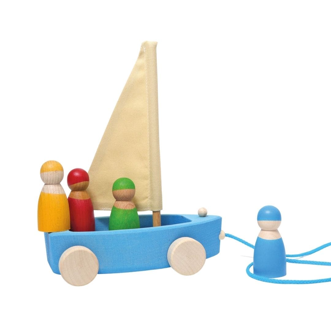 Grimm's Wooden Land Yacht, shown with 3 peg people on board and one out front by the blue bow line