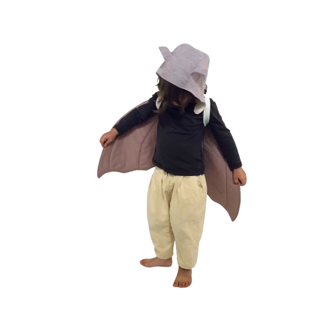 (Rotated view) Child standing up, twirling, wearing brown and gray colored bat costume- Bella Luna Toys