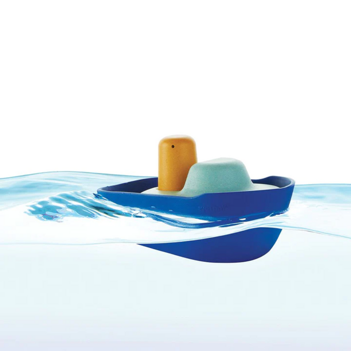 PlanToys- Picture of blue tugboat bath toy in water- Bella Luna Toys