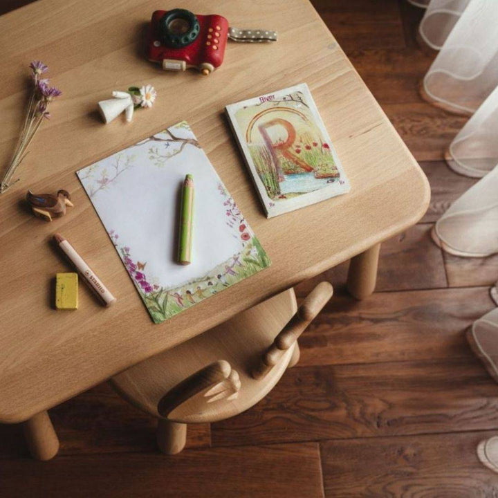 Summer Note Paper on Desk | Wooden Desk displayed with Waldorf Family Alphabet Cards| Wooden Camera| Pencils and Eraser| Wooden Fairy and Wooden Duck