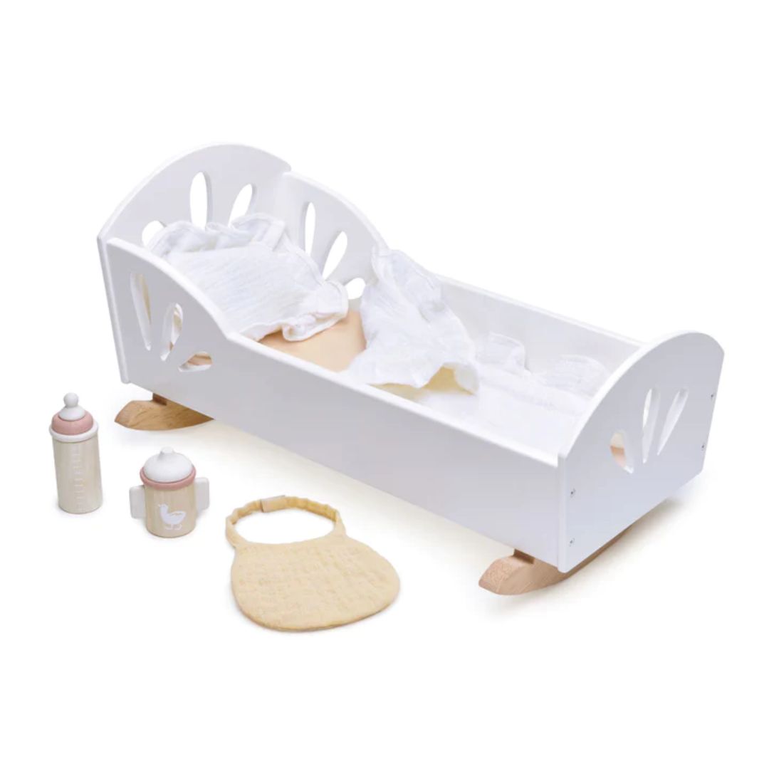 Tender Leaf Toys white wooden bed with wooden bottles laying to the left- Bella Luna Toys
